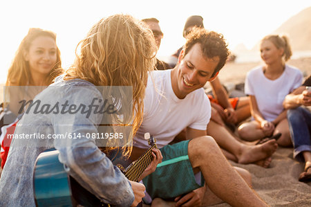 Group of friends camping on beach