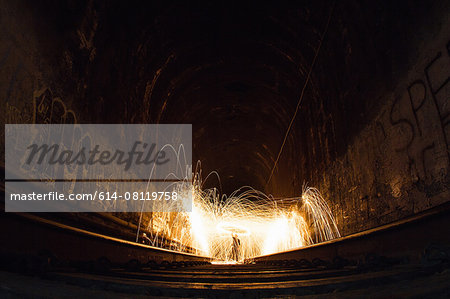 Train tunnel with light trails, low angle view