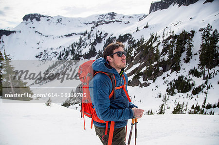 Young male skier looking out from mountainside, Mount Baker, Washington, USA