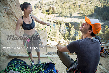 Rock climber preparing rope, Smith Rock State Park, Oregon