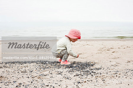 Girl playing on beach