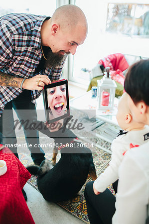 Family talking via digital tablet