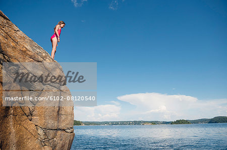 Girl standing on cliff
