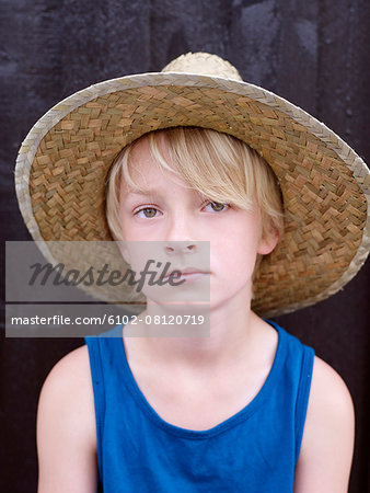 Boy wearing straw hat