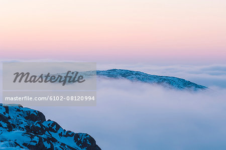 Clouds above mountains at dawn