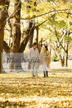 Senior Japanese couple in a city park in Autumn