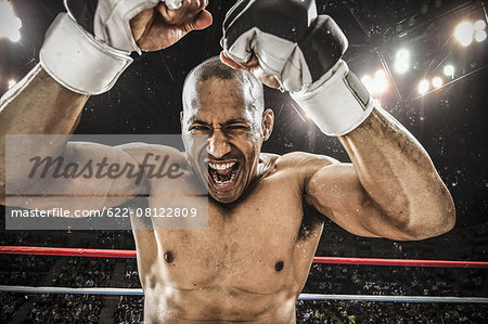 Bald male athlete in a fighting pose