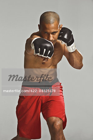 Bald male athlete in a fighting pose