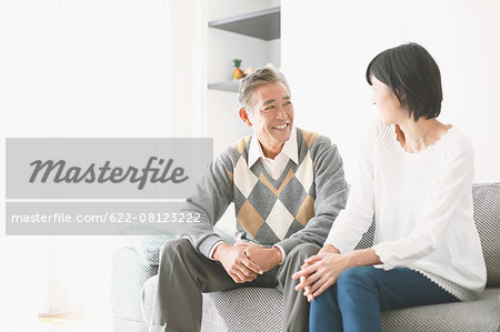 Japanese senior and daughter on the sofa