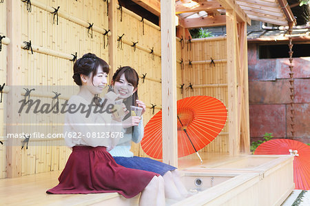 Young Japanese women enjoying foot spa in Kawagoe, Japan