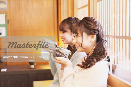 Young Japanese women enjoying Maccha green tea in Kawagoe, Japan