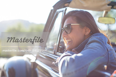 Mature woman in convertible car