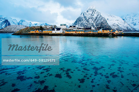 Reine fishing village with snow capped mountains, Norway