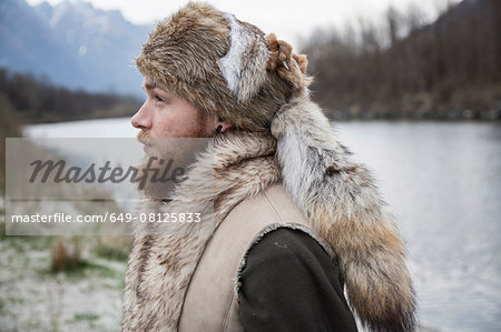 Mid adult man wearing trapper hat, portrait