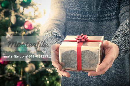 Person holding christmas gift