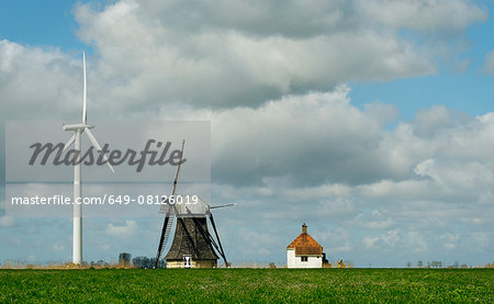 Landscape with wind turbine and windmill face to face, Workum, Friesland, Netherlands Landscape with wind turbine and windmill face to face, Workum, Friesland, Netherlands