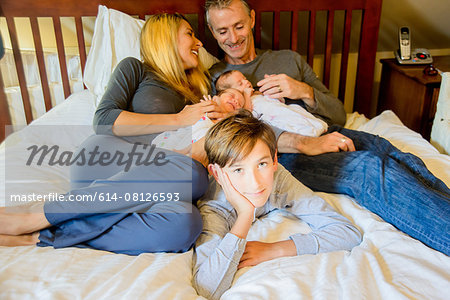 Couple with son and newborn twin girl and boy Couple with son and newborn twin girl and boy