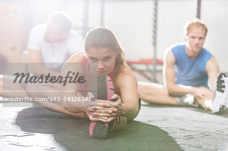 Portrait of confident woman exercising in crossfit gym