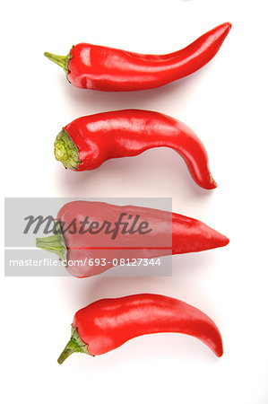 Close-up of chilli pepper on white background Close-up of chilli pepper on white background
