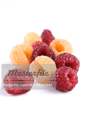 Studio shot of red and yellow raspberries