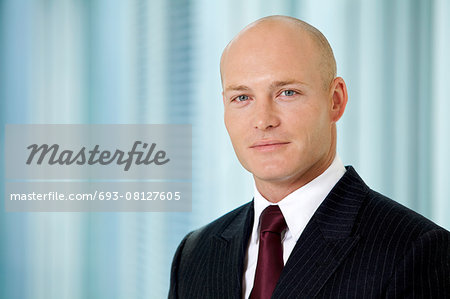 Portrait of young caucasian businessman in office