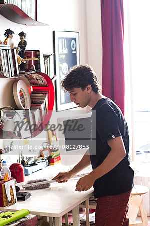 Teenager cleaning his desk