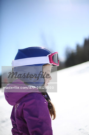 Portrait of a 5 years old little girl in the mountains, in winter