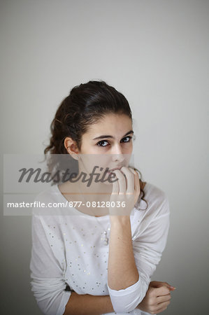 Portrait of a teenage girl, she seems to be worried