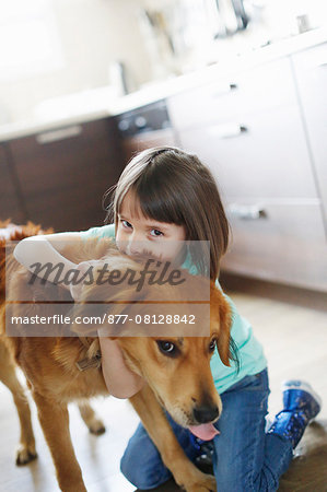 Girl playing with a dog