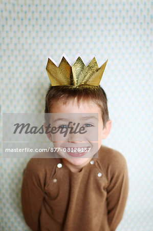 6 years old boy wearing a king crown