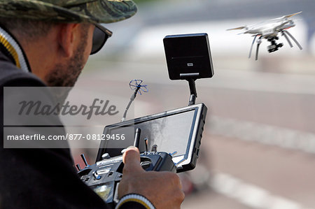 France,Côte d'Or. Dijon. Man piloting a surveillance drone / shots.