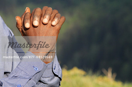 African pilgrim praying. France.