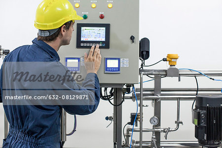 Skilled worker operating industrial equipment