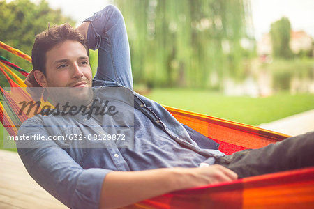 Man reclining in hammock