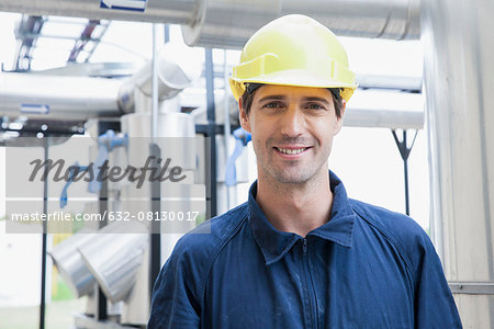 Engineer at industrial plant, portrait