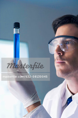 Researcher examining test tube in laboratory