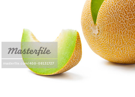 Ripe fresh melon honeydew and a slice close-up isolated on white background
