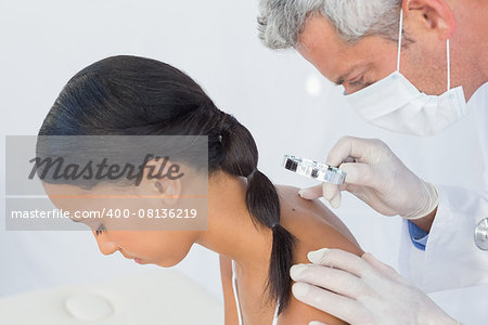 Side view of a doctor visiting patient in hospital