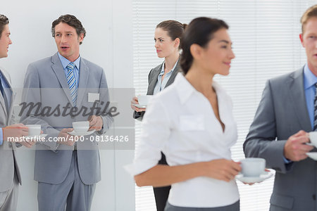 Business people drinking cup of coffee in the meeting room