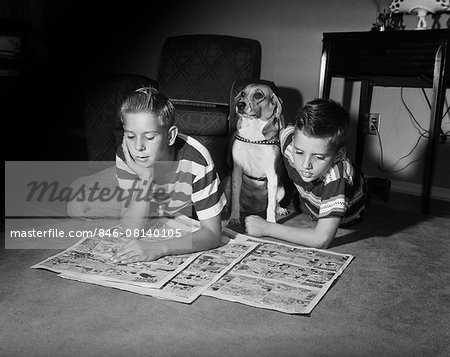 1950s TWO BOYS READING SUNDAY COMICS LIVING ROOM FLOOR DOG INDOOR FUNNY PAPERS NEWSPAPERS