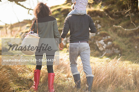 Mid adult couple on walk holding hands