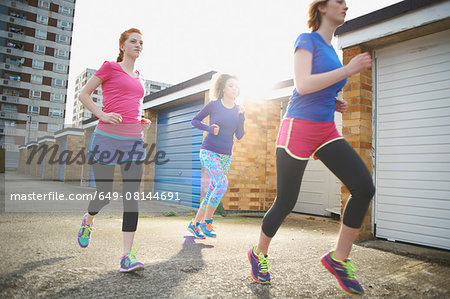 Three women exercising and jogging together