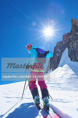 Mature female skier moving up Mont Blanc massif, Graian Alps, France