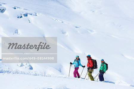 Three mature adult skiers on Mont Blanc massif, Graian Alps, France