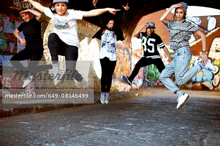 Young women jumping in mid air