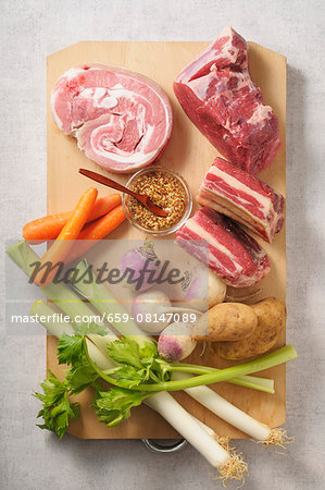 Ingredients for pot au feu on a chopping board