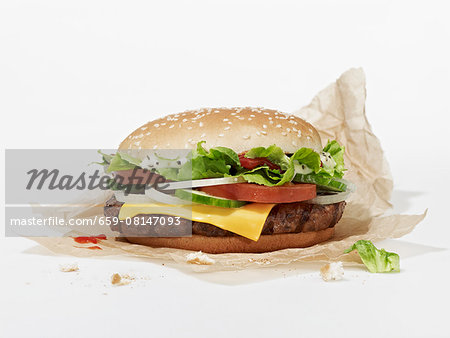 A cheeseburger on a piece of paper