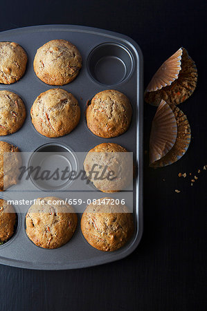 Freshly baked carrot muffins in a muffin tin