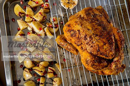 Roast chicken with balsamic potatoes and pomegranate seeds