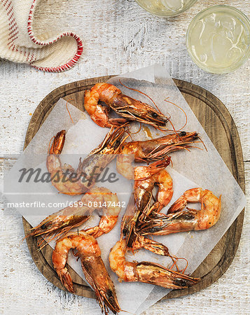 Grilled prawns on parchment paper